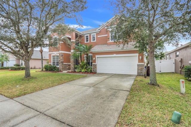 view of front facade with a front yard and a garage