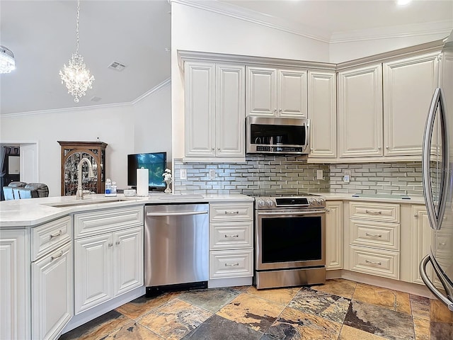 kitchen with appliances with stainless steel finishes, tasteful backsplash, sink, a chandelier, and vaulted ceiling