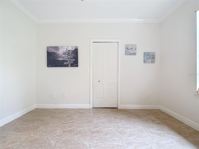 spare room featuring crown molding