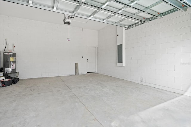 garage featuring a garage door opener, electric water heater, and electric panel