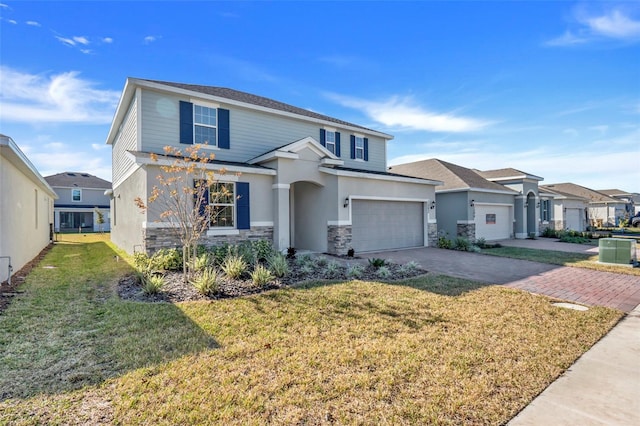 view of front of home featuring driveway, a garage, stone siding, a residential view, and a front yard