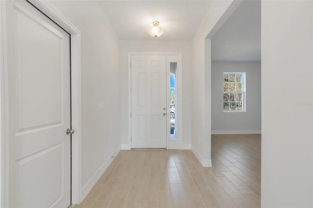 entrance foyer featuring light wood-style floors and baseboards