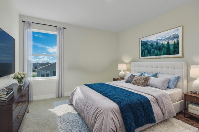 bedroom featuring carpet floors and baseboards