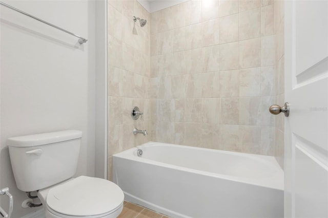 bathroom with shower / bathing tub combination and toilet