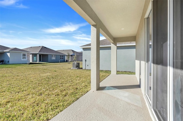 view of yard with a patio area, a residential view, and central air condition unit