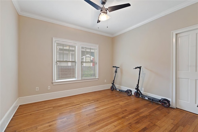 empty room featuring ceiling fan, ornamental molding, and light hardwood / wood-style floors