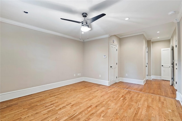 spare room featuring ceiling fan, light wood-type flooring, and ornamental molding