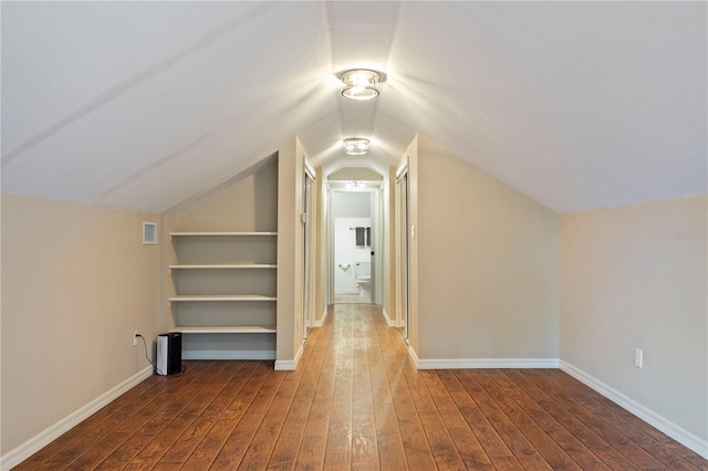 bonus room with dark hardwood / wood-style flooring and lofted ceiling