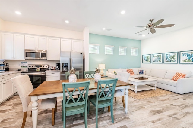 kitchen featuring white cabinetry, ceiling fan, and appliances with stainless steel finishes