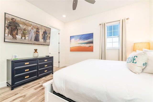 bedroom featuring ceiling fan and light hardwood / wood-style floors