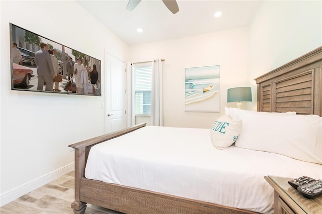 bedroom with ceiling fan and light wood-type flooring