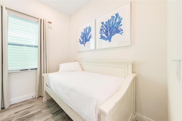 bedroom with light hardwood / wood-style floors