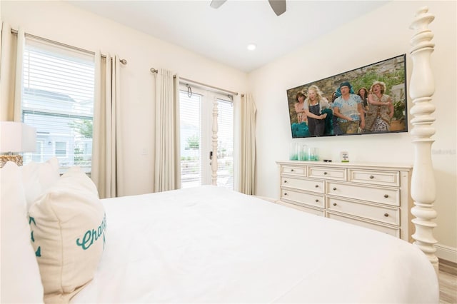 bedroom featuring ceiling fan, light hardwood / wood-style flooring, and access to outside