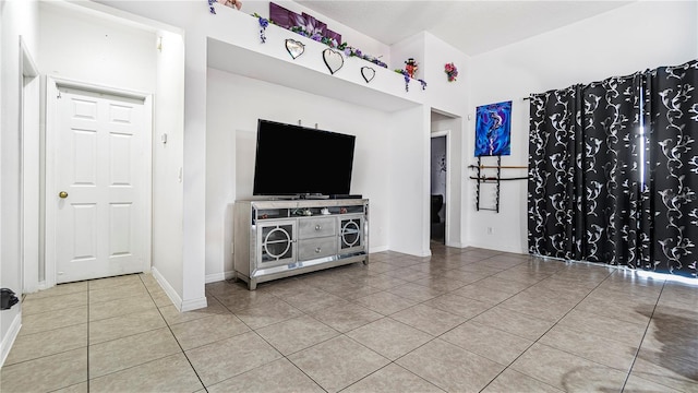 unfurnished living room with tile patterned floors