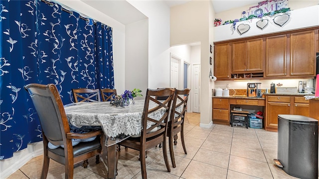 dining area featuring light tile patterned floors