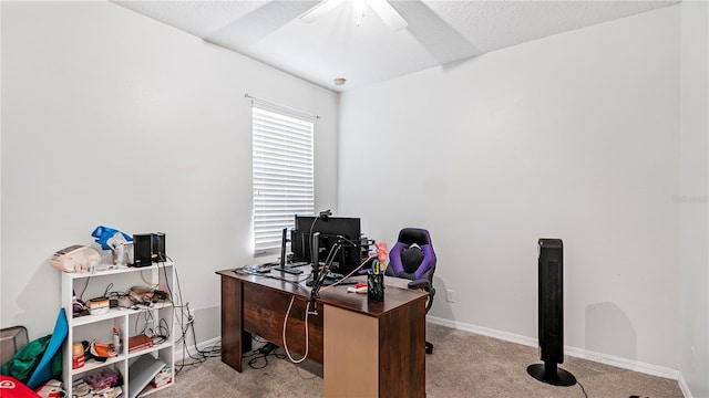 home office with ceiling fan and light carpet