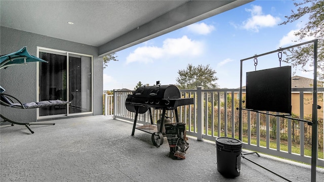 exterior space featuring a balcony and grilling area