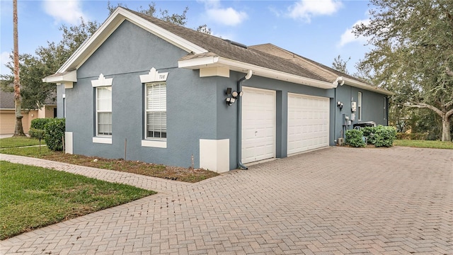 view of side of home featuring a garage