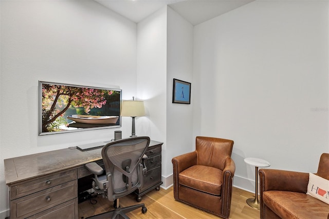 office space with light hardwood / wood-style floors