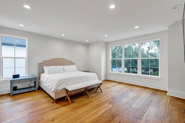 bedroom with light hardwood / wood-style floors