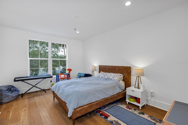 bedroom with wood-type flooring