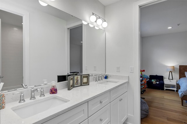 bathroom featuring wood-type flooring and vanity