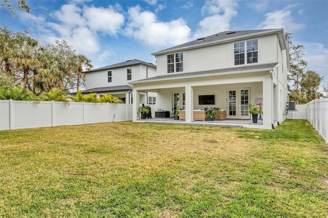 rear view of house featuring an outdoor hangout area, central AC, a lawn, and a patio