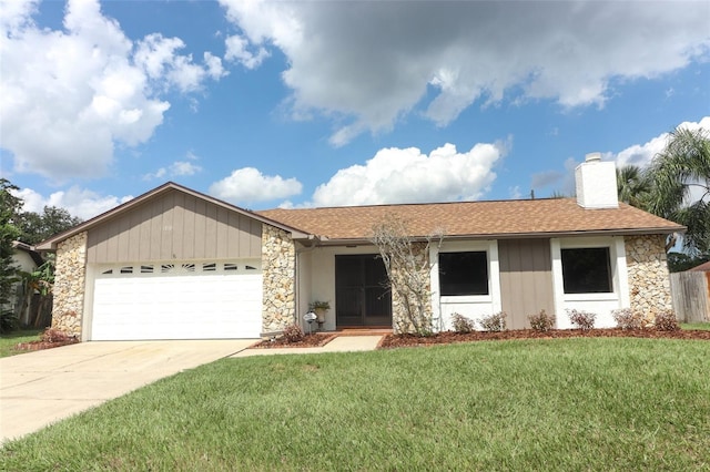 ranch-style home with a front yard and a garage