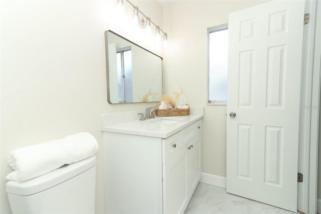 bathroom with toilet and vanity