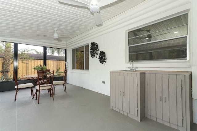 sunroom featuring sink and ceiling fan