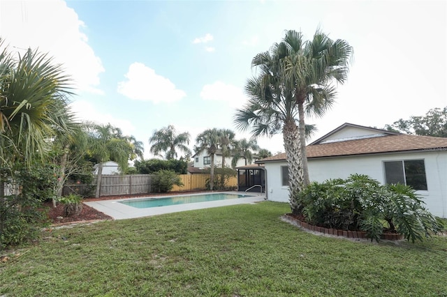 view of yard with a fenced in pool