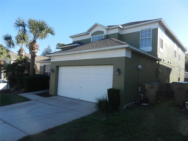 view of side of home featuring a garage