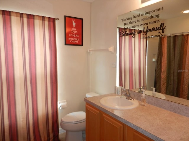 bathroom with vanity and toilet