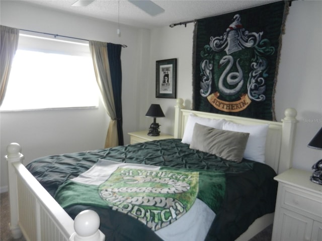 bedroom with a textured ceiling and ceiling fan