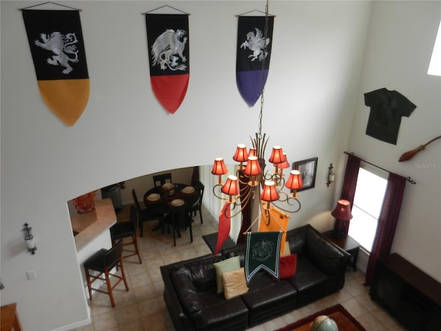 tiled living room featuring a chandelier