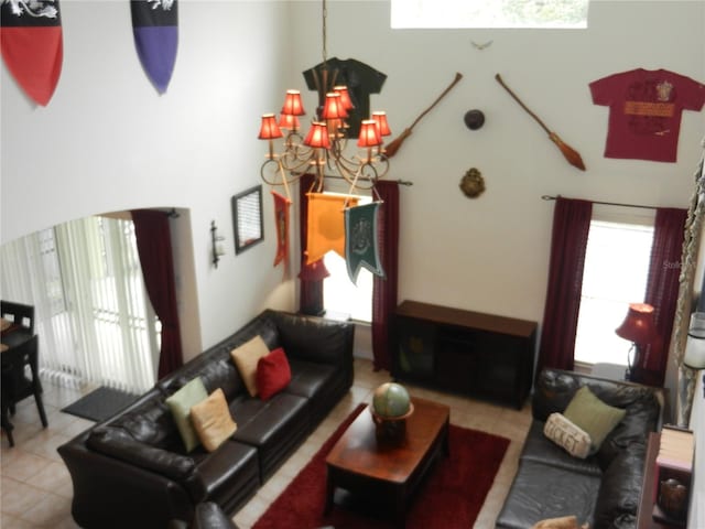 living room featuring light tile patterned flooring and an inviting chandelier