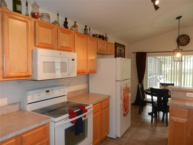 kitchen featuring white appliances, vaulted ceiling, light tile patterned floors, and pendant lighting