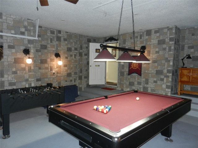 playroom featuring pool table and a textured ceiling