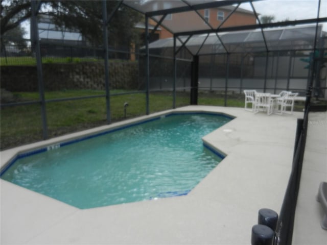 view of pool with a lanai and a patio area