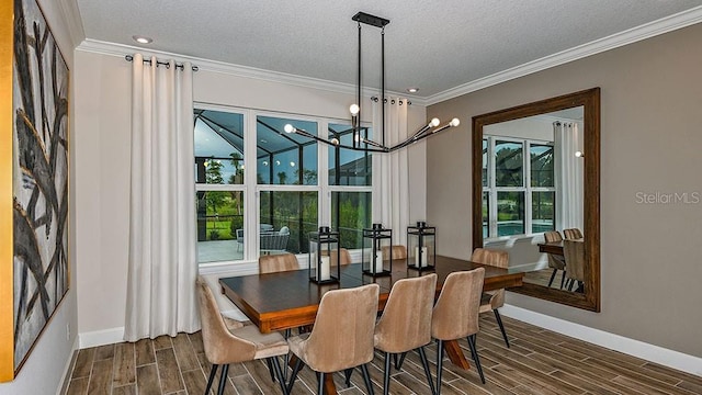 dining room with a wealth of natural light and crown molding