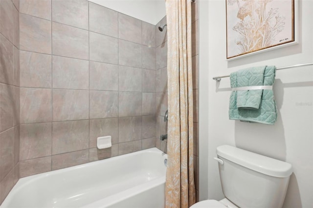 bathroom with shower / tub combo and toilet