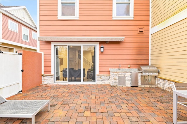 view of patio / terrace with sink and area for grilling