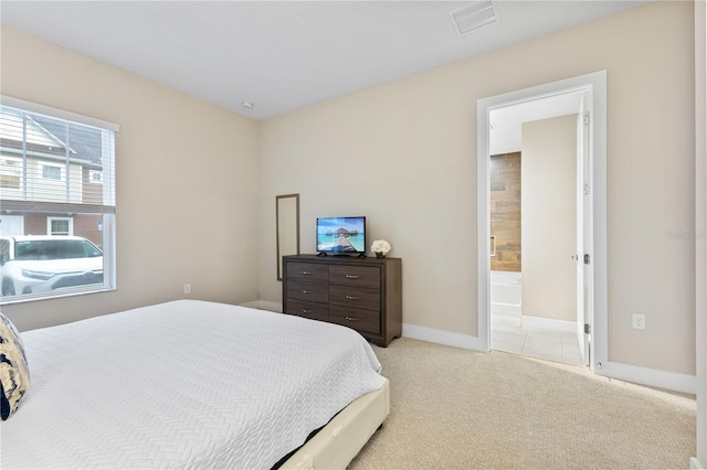 carpeted bedroom featuring connected bathroom