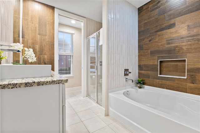 bathroom with shower with separate bathtub, tile patterned floors, and vanity