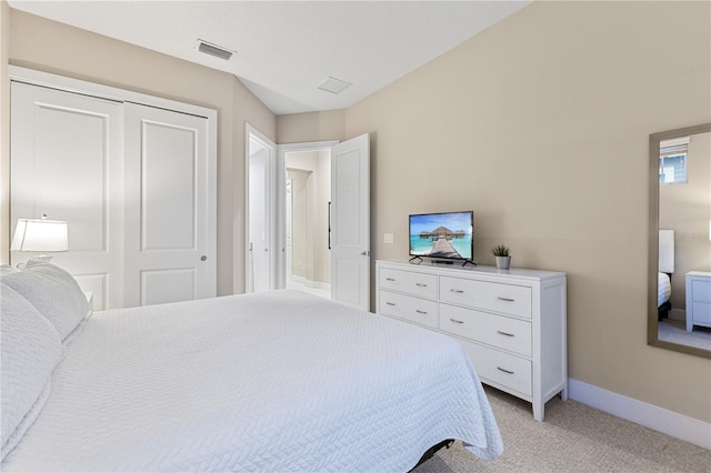 carpeted bedroom with a closet