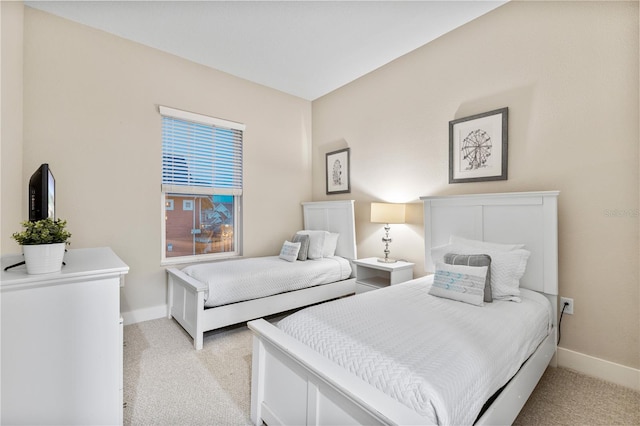 bedroom featuring light colored carpet