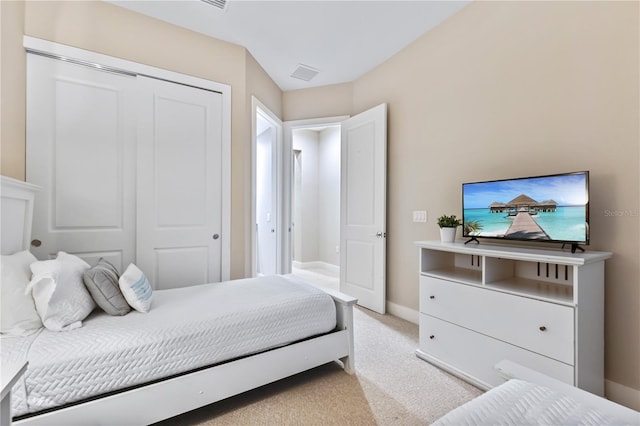 carpeted bedroom with a closet