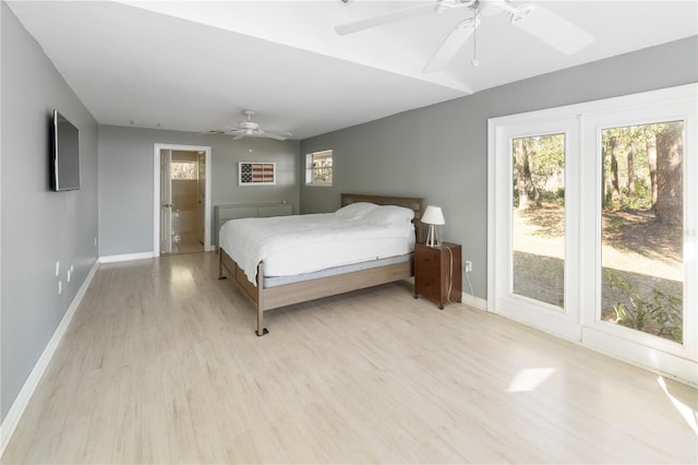 bedroom with ceiling fan, access to exterior, and light hardwood / wood-style floors