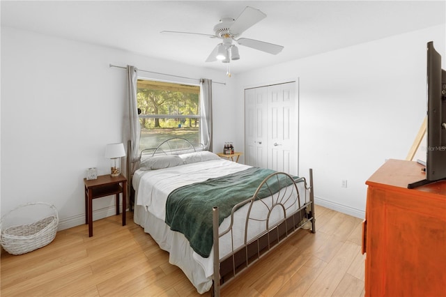 bedroom featuring a closet, ceiling fan, and light hardwood / wood-style flooring