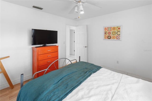 bedroom featuring wood-type flooring and ceiling fan